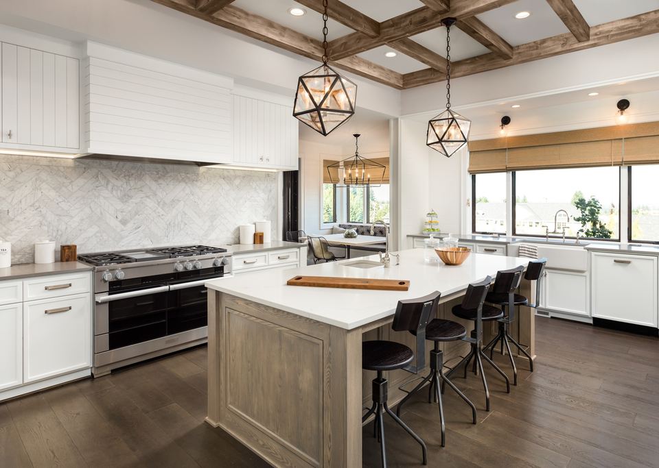 Farmhouse-style kitchen with a large island and a professional range